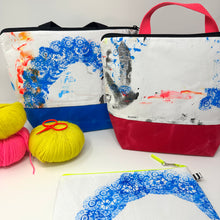 Load image into Gallery viewer, Colorful bags with artistic designs and yarn balls on a white background