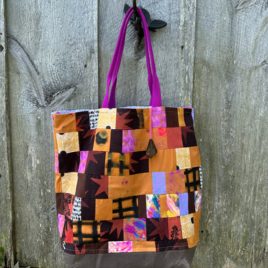patchwork tote bag with brown, gold and red block printed fabric