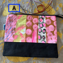 Load image into Gallery viewer, Colorful fabric pouch with various patterns on a textured surface
